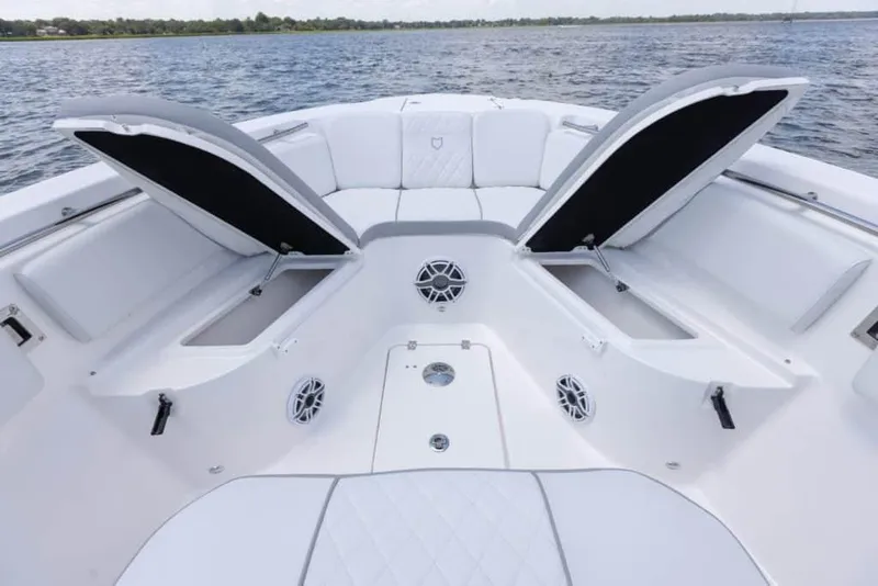 Slide: The Image of Manufacturer Provided Image: 2024 Sea Fox 288 Commander boat with open storage compartments on the water. - 7