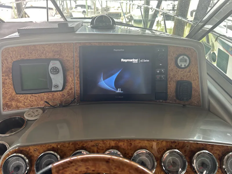 Slide: The Image of 2007 Formula 31 PC dashboard with Raymarine eS Series display and navigation instruments. - 13