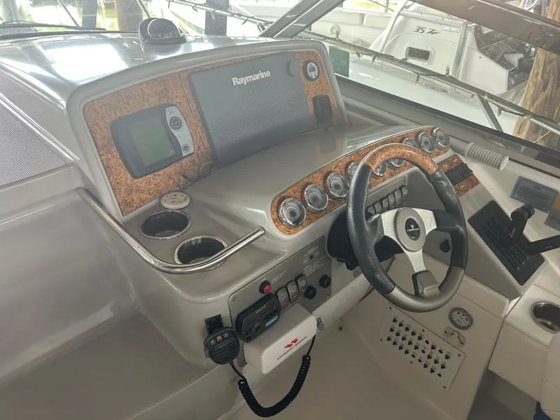 Slide: The Image of 2007 Formula 31 PC boat dashboard with steering wheel and navigation equipment. - 14