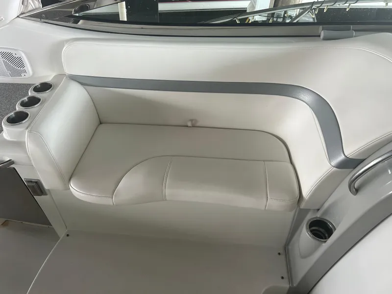 Slide: The Image of 2007 Formula 31 PC boat interior with white leather seating and cup holders. - 16