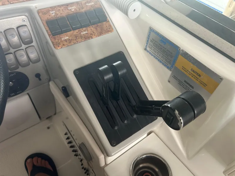 Slide: The Image of Control panel of a 2007 Formula 31 PC boat with throttle levers and switches. - 17