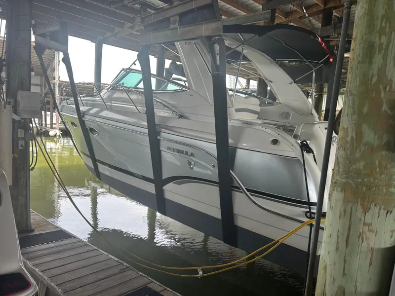 Slide: The Image of 2007 Formula 31 PC boat suspended in a covered dock area. - 2
