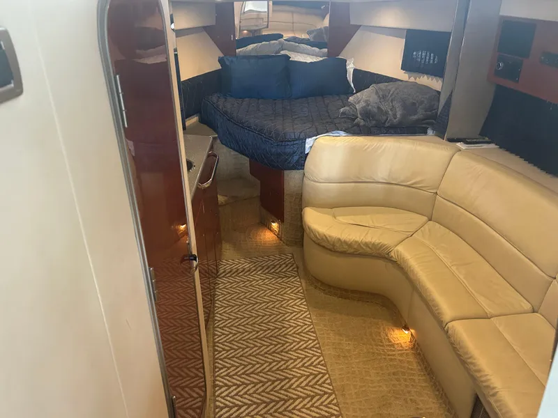 Slide: The Image of 2007 Formula 31 PC yacht interior with beige leather seating and cozy sleeping area. - 20