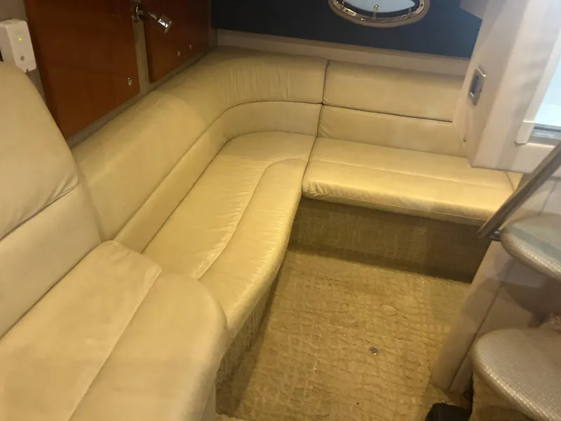 Slide: The Image of 2007 Formula 31 PC yacht interior with beige leather seating and wooden cabinets. - 26