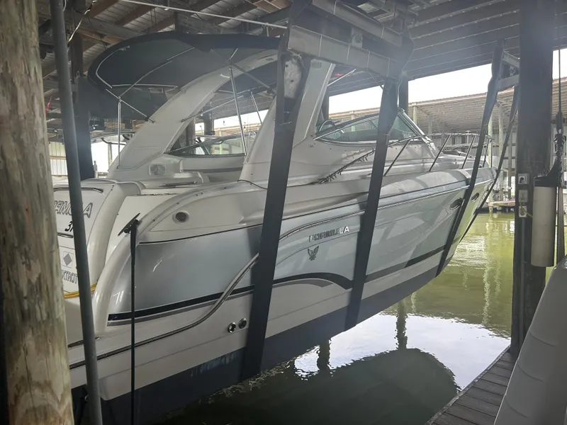 Slide: The Image of 2007 Formula 31 PC boat suspended in a covered dock area. - 3
