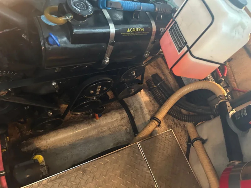 Slide: The Image of Engine compartment of a 2007 Formula 31 PC boat, showing belts and hoses. - 42