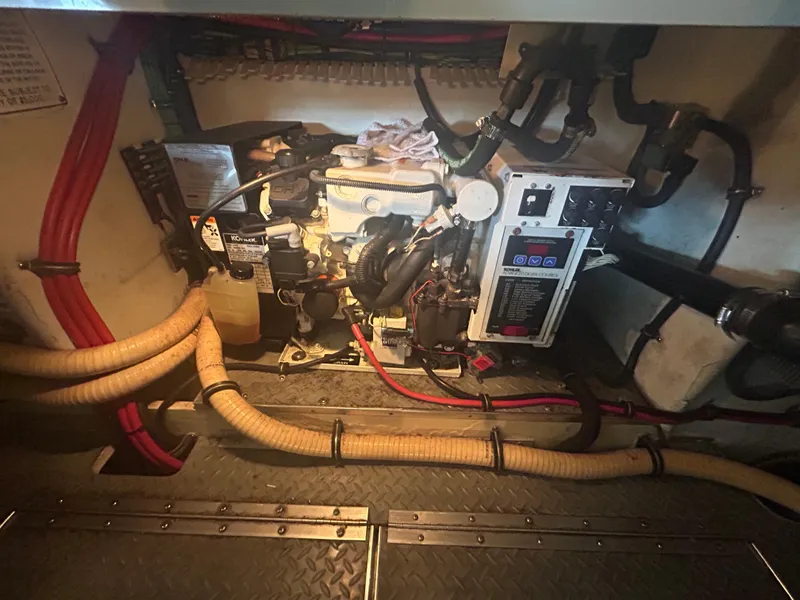 Slide: The Image of Engine room of a 2007 Formula 31 PC boat, featuring various hoses and components. - 45