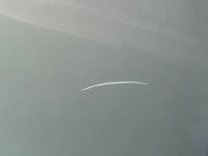 Slide: The Image of Scratch on 2007 Formula 31 PC boat surface, close-up view. - 5