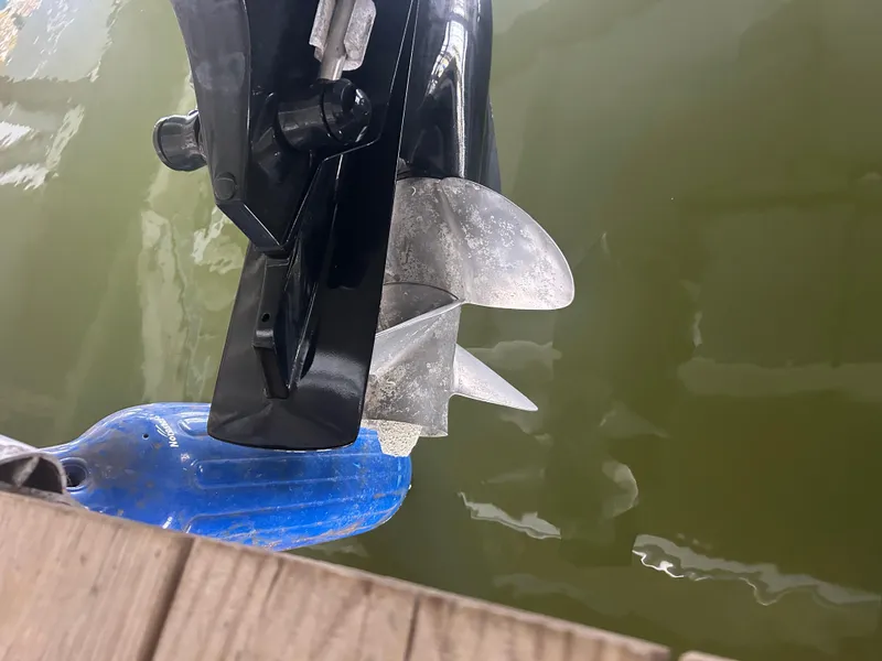 Slide: The Image of Propeller of a 2007 Formula 31 PC boat submerged in water near a dock. - 8