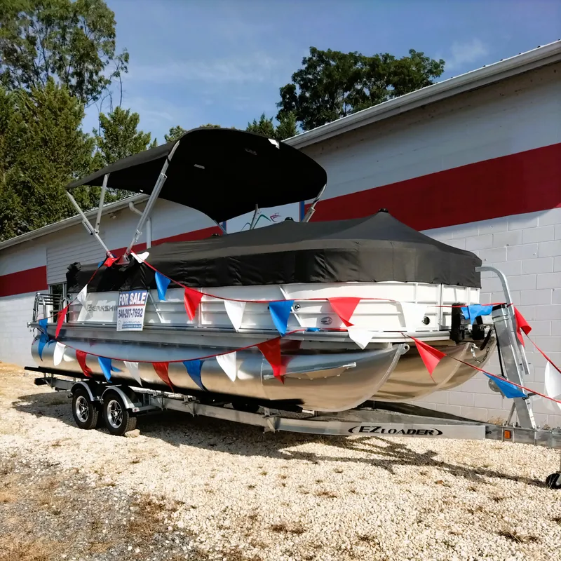 Slide: The Image of 2024 Berkshire 22RFX CTS 2.75 Performance pontoon boat for sale, displayed outdoors. - 1