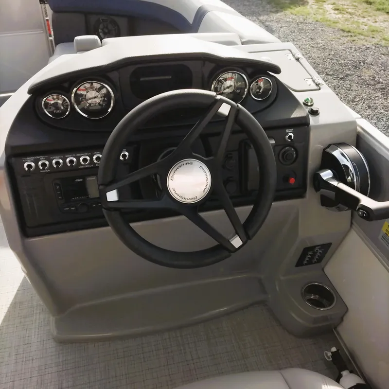 Slide: The Image of 2024 Berkshire 22RFX CTS 2.75 Performance boat dashboard with steering wheel and controls. - 3