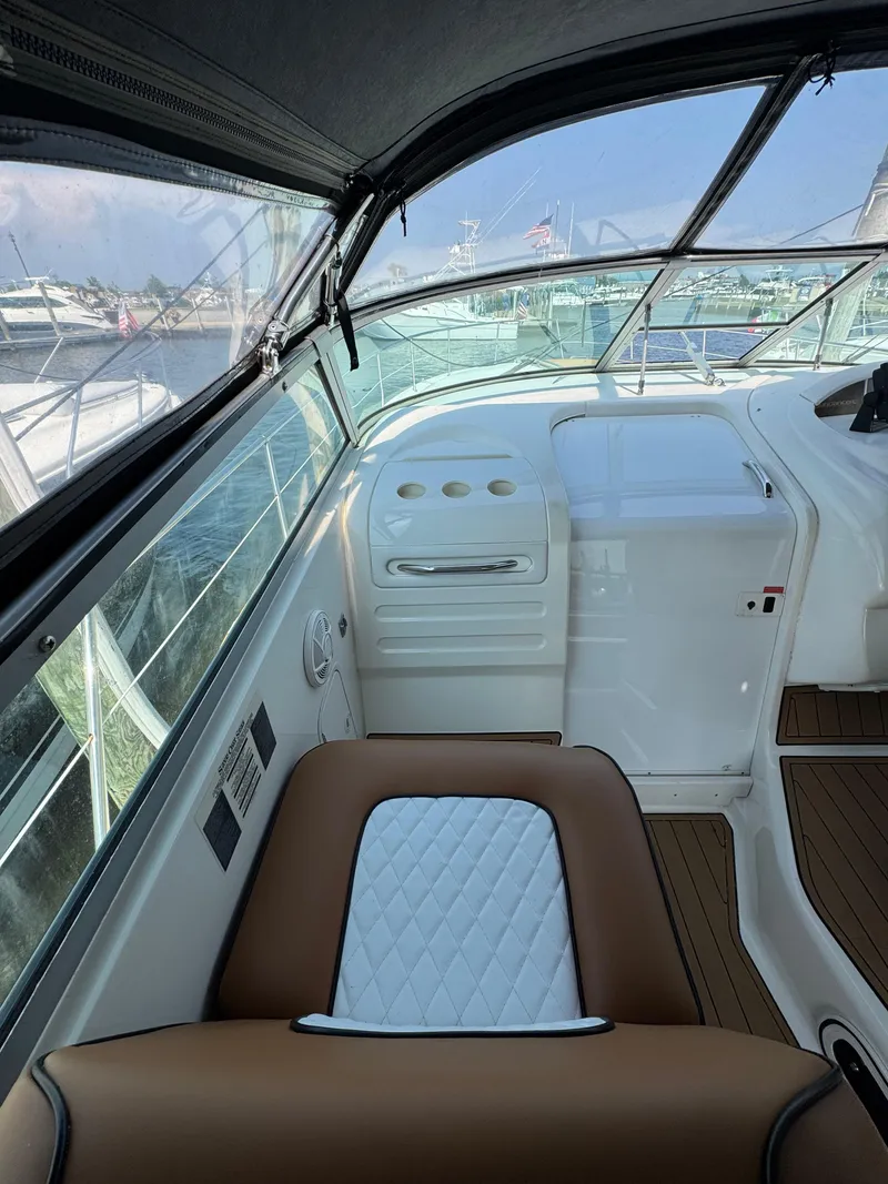 Slide: The Image of Interior view of 1995 Sea Ray 370 Sundancer boat with brown and white seating. - 18