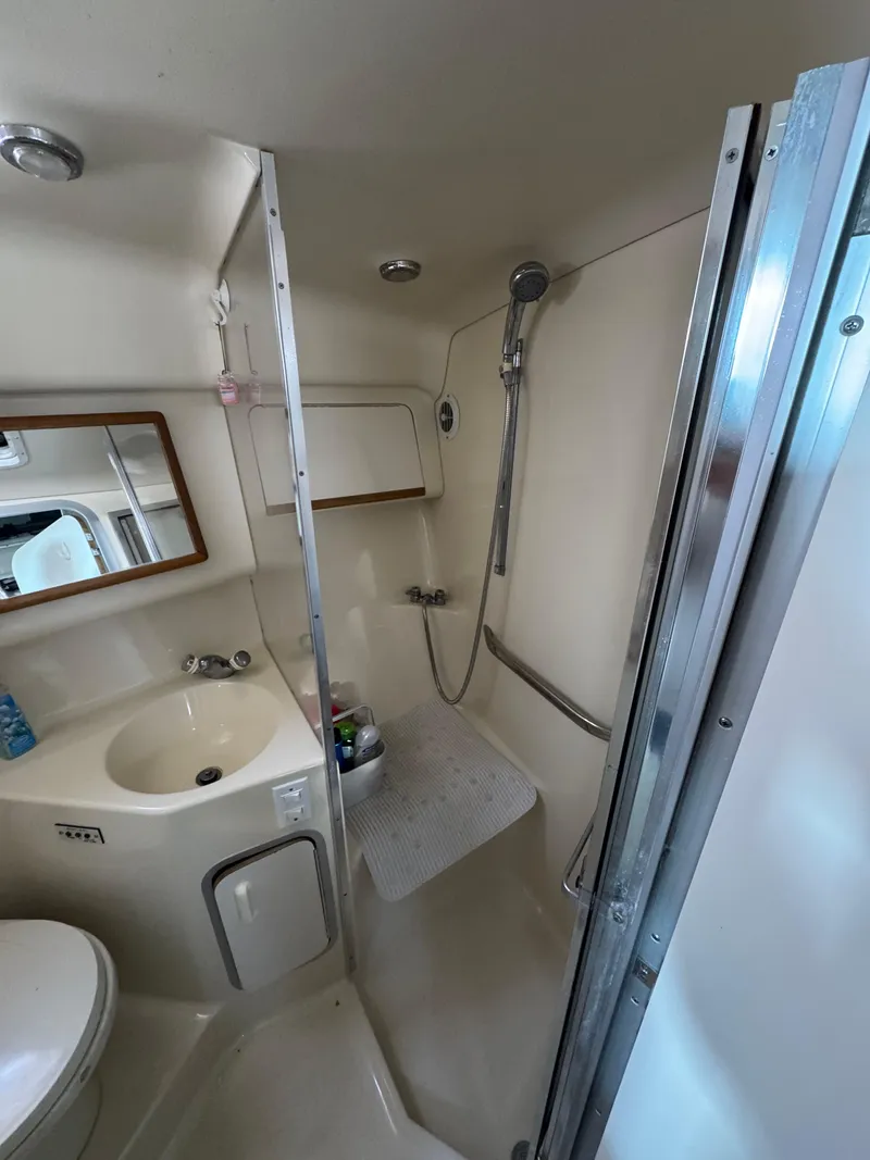 Slide: The Image of Bathroom interior of 1995 Sea Ray 370 Sundancer yacht with shower and sink. - 22