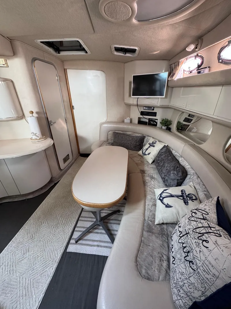 Slide: The Image of Interior of 1995 Sea Ray 370 Sundancer yacht with cozy seating and nautical decor. - 24