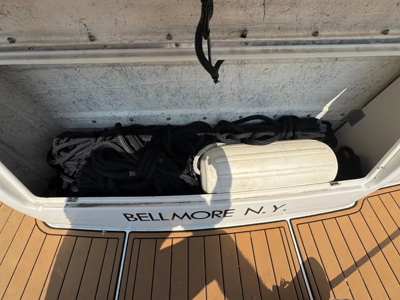 Slide: The Image of 1995 Sea Ray 370 Sundancer storage with ropes and fender, Bellmore N.Y. location. - 4