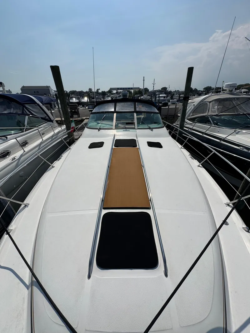Slide: The Image of 1995 Sea Ray 370 Sundancer yacht docked at marina, top deck view. - 9