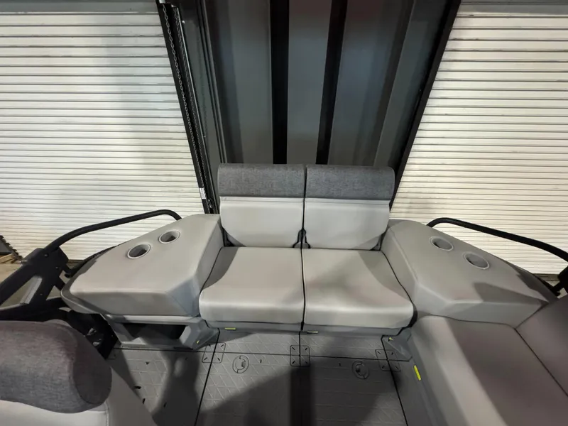 Slide: The Image of 2025 Sea-Doo Switch Cruise 18 interior seating with cup holders, gray upholstery. - 5