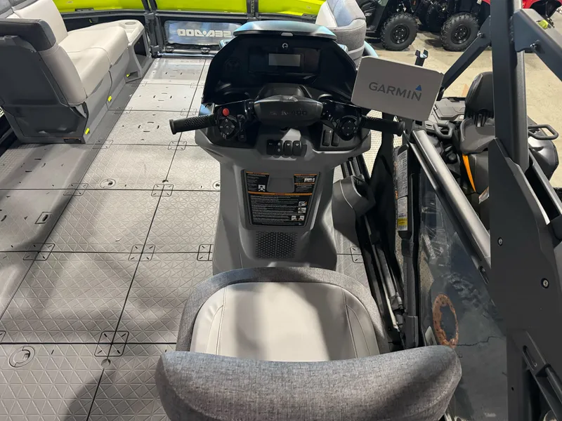 Slide: The Image of Interior view of 2025 Sea-Doo Switch Cruise 18 with Garmin navigation system. - 7
