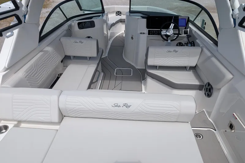 Slide: The Image of 2026 Sea Ray SDX 230 Surf boat interior with luxurious seating and modern dashboard. - 11
