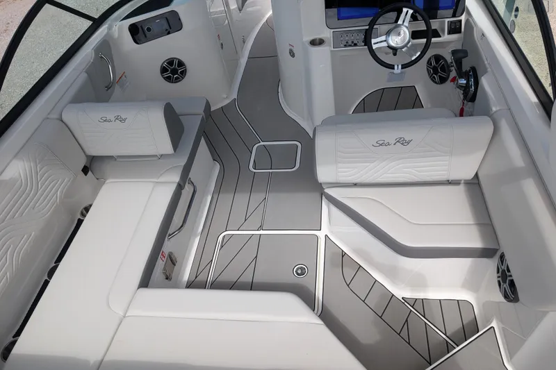 Slide: The Image of 2026 Sea Ray SDX 230 Surf boat interior with sleek seating and modern dashboard design. - 12