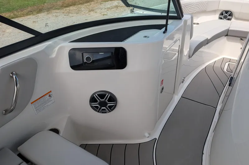 Slide: The Image of Interior view of 2026 Sea Ray SDX 230 Surf boat, featuring seating and audio system. - 15