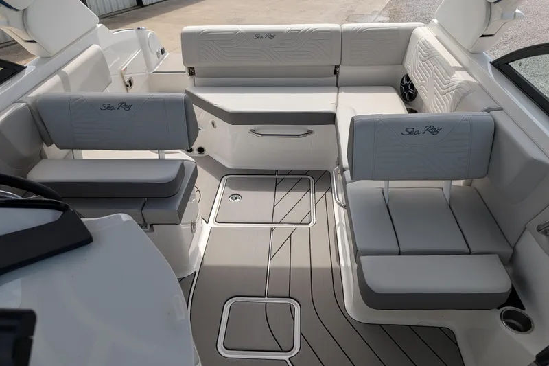 Slide: The Image of 2026 Sea Ray SDX 230 Surf boat interior with sleek seating and modern design. - 20