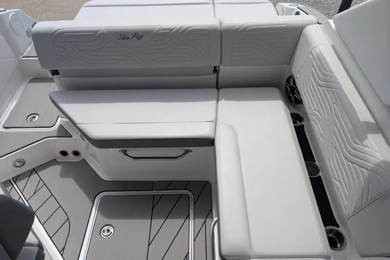Slide: The Image of 2026 Sea Ray SDX 230 Surf boat interior with sleek white seating and modern design. - 22