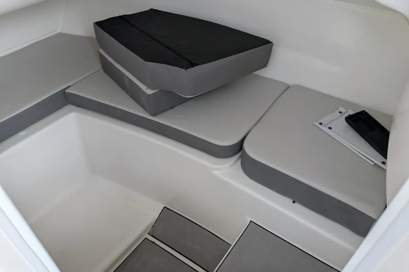 Slide: The Image of Interior seating area of 2026 Sea Ray SDX 230 Surf boat with cushions. - 27