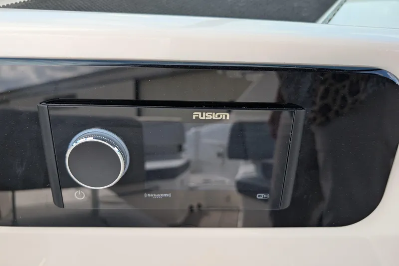Slide: The Image of Fusion audio system on 2026 Sea Ray SDX 230 Surf boat dashboard. - 29