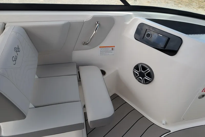 Slide: The Image of Interior of 2026 Sea Ray SDX 230 Surf boat with seating and audio system. - 33