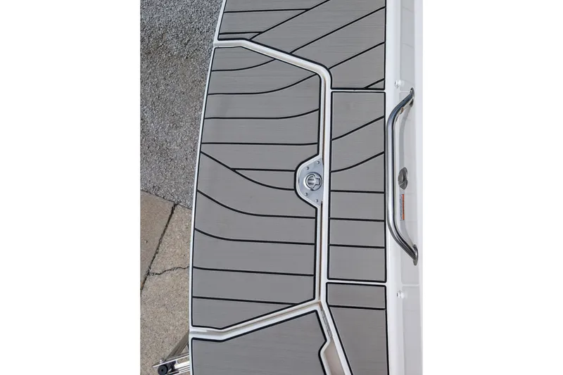 Slide: The Image of 2026 Sea Ray SDX 230 Surf boat deck with sleek, modern design and textured surface. - 35