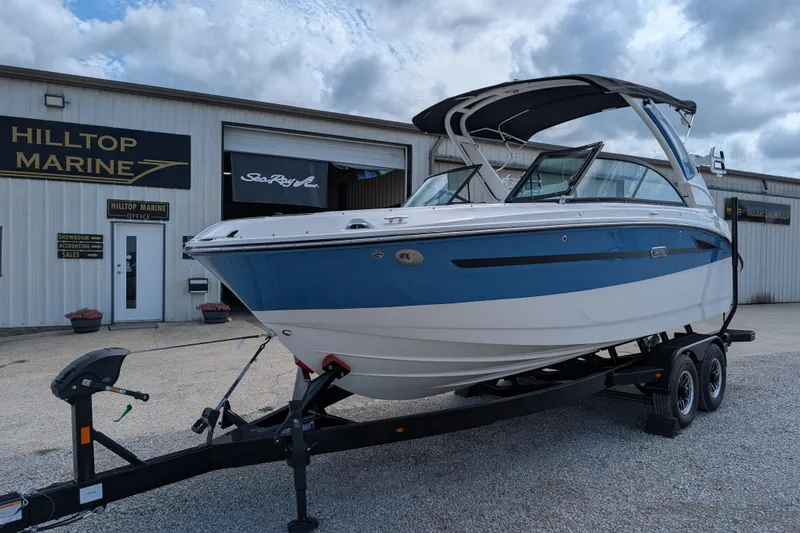 Slide: The Image of 2026 Sea Ray SDX 230 Surf boat on trailer at Hilltop Marine dealership. - 5