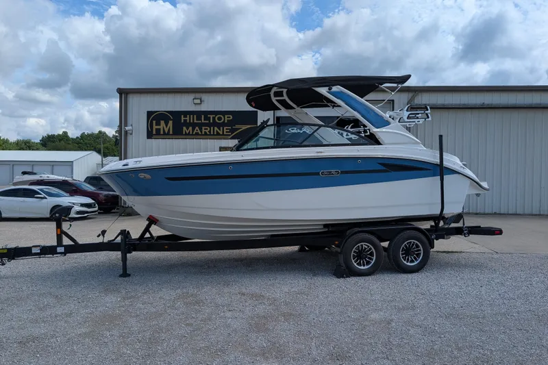 Slide: The Image of 2026 Sea Ray SDX 230 Surf boat on trailer at Hilltop Marine dealership. - 6