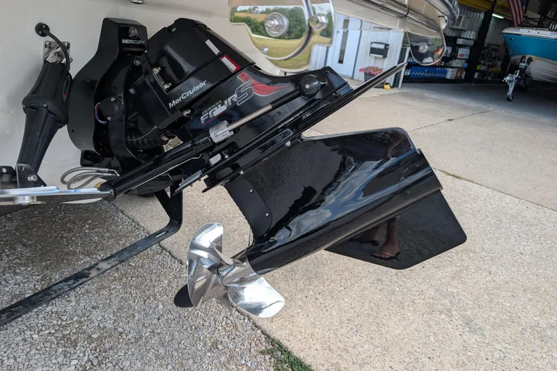 Slide: The Image of 2026 Sea Ray SDX 230 Surf boat with Mercury MerCruiser engine and propeller detail. - 9