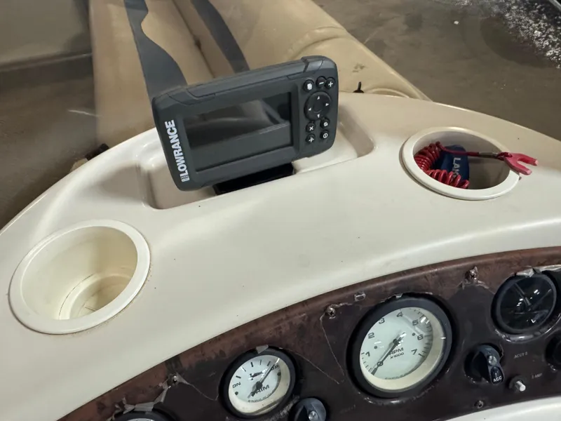 Slide: The Image of Dashboard of a 2003 Bennington 205L boat with Lowrance device and gauges. - 12