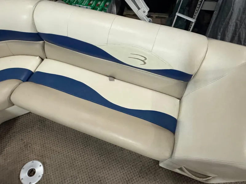 Slide: The Image of Beige and blue boat seating on a 2003 Bennington 205L. - 8
