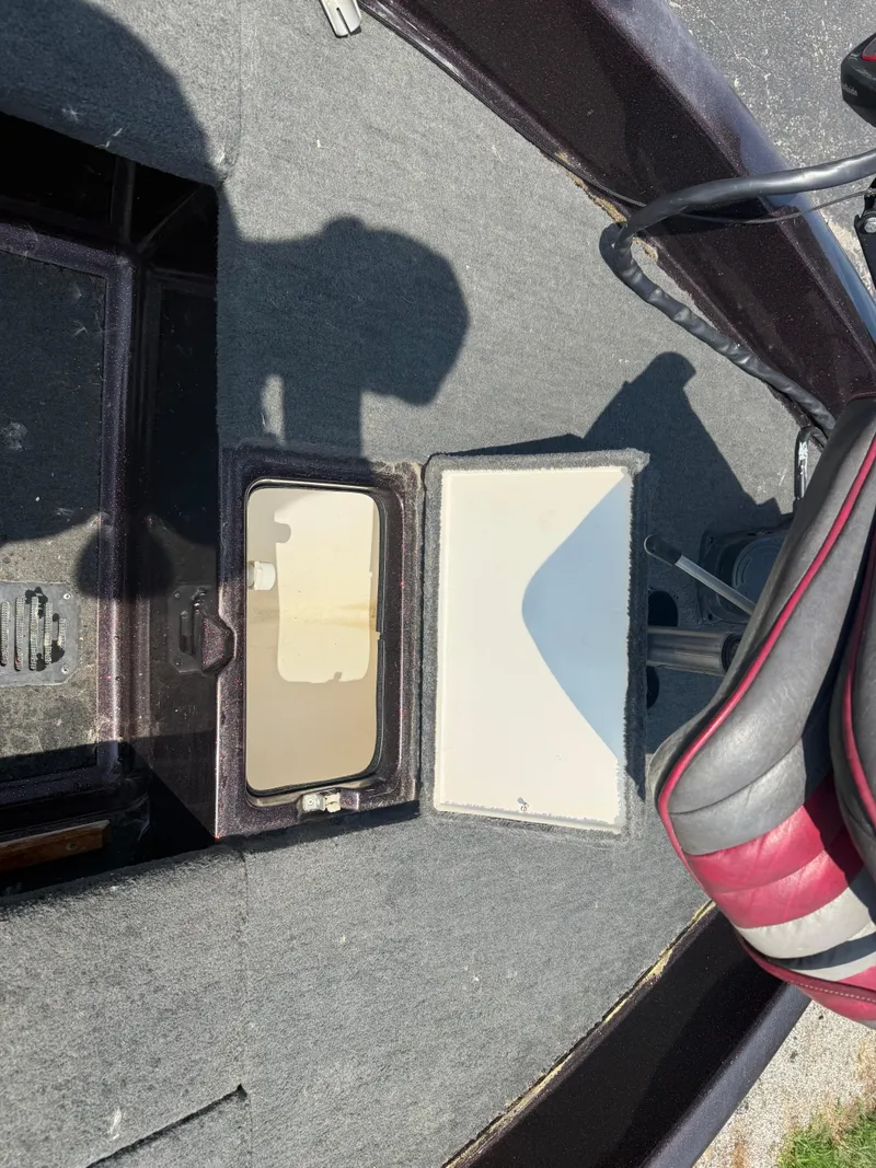 Slide: The Image of Interior of a 1992 Ranger 320v boat showing storage compartments and seating. - 6