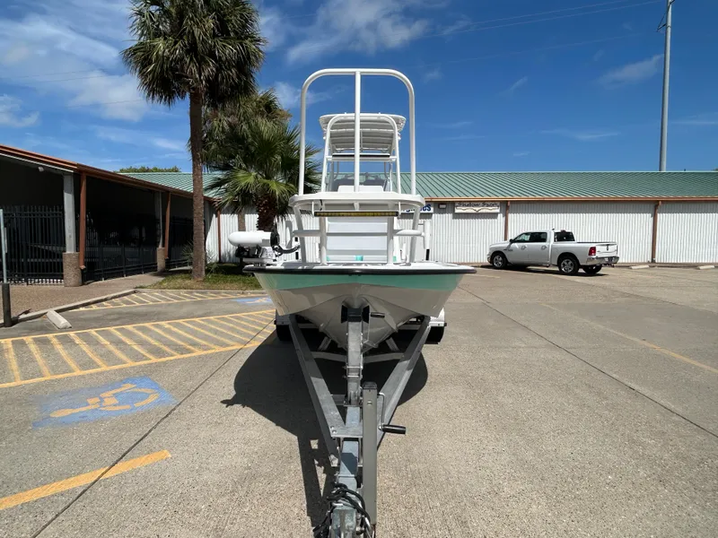 Slide: The Image of 2024 Shallow Sport 24 Modified V boat on trailer in parking lot. - 5