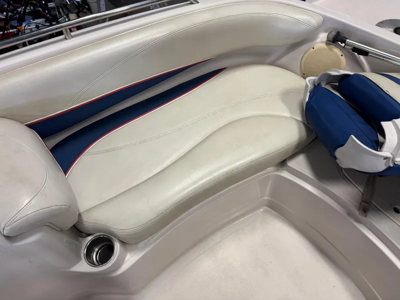 Slide: The Image of 2015 Tahoe 215 Xi boat interior with white and blue seating. - 15