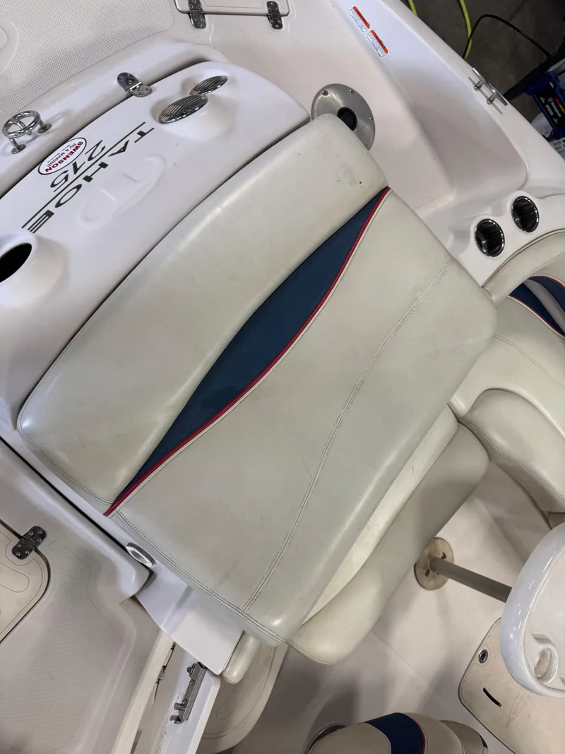 Slide: The Image of 2015 Tahoe 215 Xi boat seat with white and blue upholstery. - 6