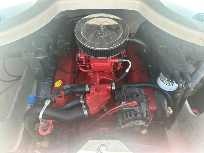 Slide: The Image of Engine of a 2006 Monterey 194 FS boat, featuring a red and black design. - 10