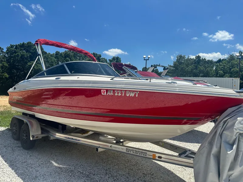 Slide: The Image of Red 2006 Monterey 194 FS boat on trailer under clear blue sky. - 3