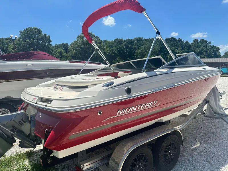 Slide: The Image of 2006 Monterey 194 FS boat with red and white design on a trailer. - 4