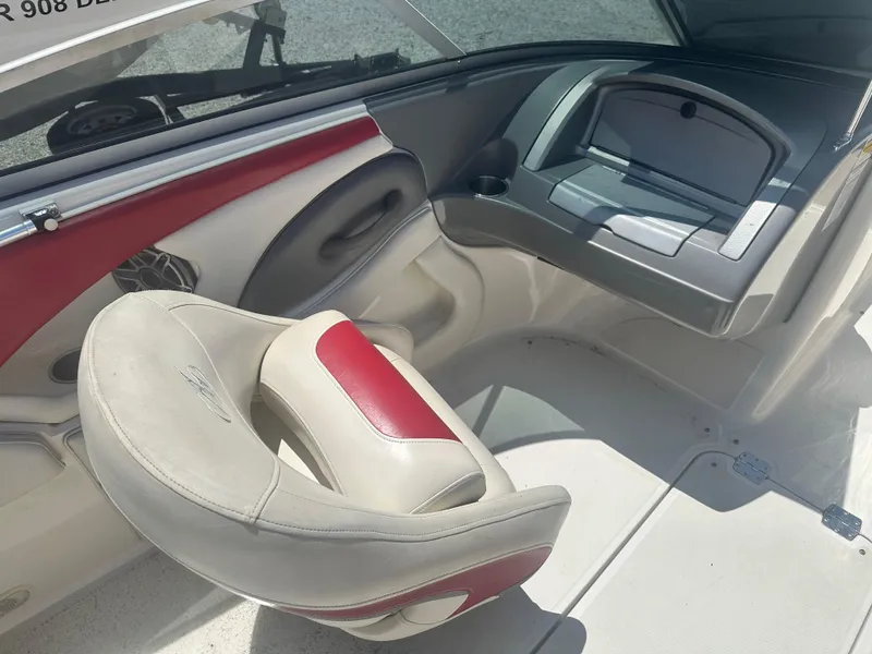 Slide: The Image of Interior of a 2006 Monterey 194 FS boat with red and white seating. - 6
