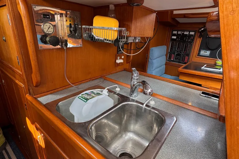 Slide: The Image of Interior of 1998 Hylas 46 yacht kitchen with sink and control panel. - 16