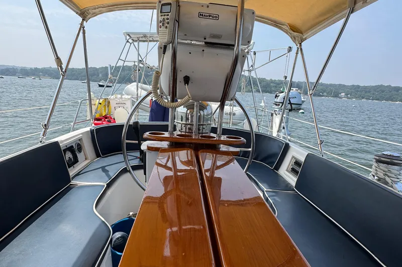 Slide: The Image of Sailboat cockpit view, Hylas 46, 1998 model, with wooden table and navigation equipment. - 25