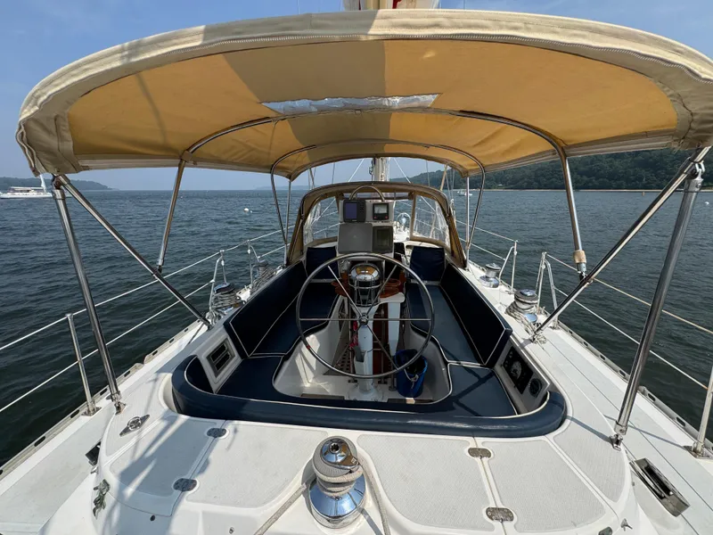 Slide: The Image of Sailboat cockpit view, Hylas 46, 1998 model, with canopy on calm water. - 5