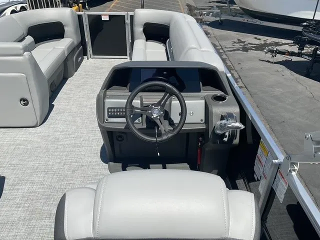 Slide: The Image of 2026 Sun Tracker Party Barge 20 DLX interior with steering console and seating. - 10