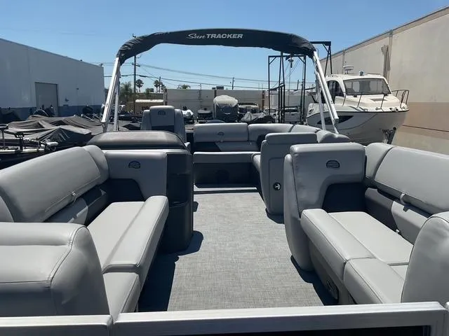 Slide: The Image of 2026 Sun Tracker Party Barge 20 DLX pontoon boat with spacious seating and canopy. - 13