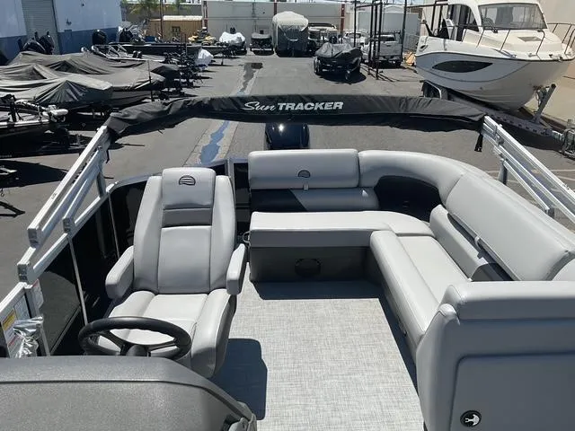 Slide: The Image of 2026 Sun Tracker Party Barge 20 DLX pontoon boat with spacious seating and sleek design. - 6